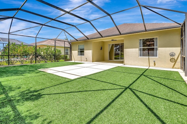 5005 Torrey Pines Run, Bradenton, FL 34211 - back of house with stucco siding, a patio area, a lawn, and roof with shingles