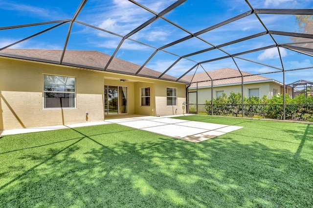5005 Torrey Pines Run, Bradenton, FL 34211 - back of house with stucco siding, a patio, a ceiling fan, and a lawn