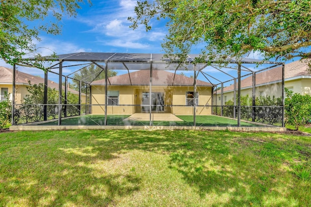 5005 Torrey Pines Run, Bradenton, FL 34211 - back of house with stucco siding, a yard, a swimming pool, and a patio