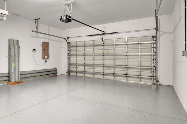 5005 Torrey Pines Run, Bradenton, FL 34211 - garage featuring a garage door opener and electric panel
