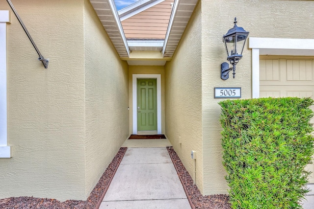 5005 Torrey Pines Run, Bradenton, FL 34211 - doorway to property featuring stucco siding