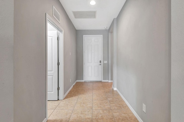 5005 Torrey Pines Run, Bradenton, FL 34211 - hall featuring light tile patterned floors and baseboards