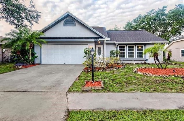 3404 56th Dr E, Bradenton, FL 34203 - ranch-style house featuring an attached garage, driveway, and stucco siding