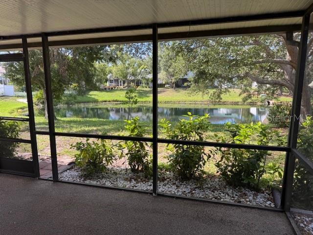 3404 56th Dr E, Bradenton, FL 34203 - unfurnished sunroom with a water view
