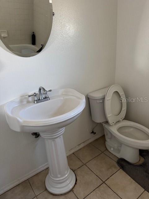 3404 56th Dr E, Bradenton, FL 34203 - half bath featuring toilet and tile patterned floors