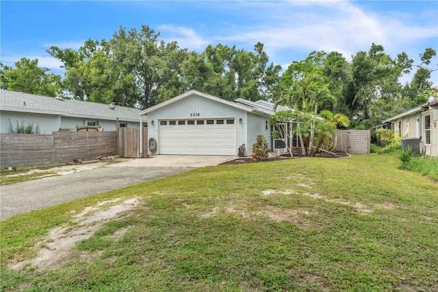 2218 Woodmere Rd, Venice, FL 34293 - single story home featuring asphalt driveway and an attached garage