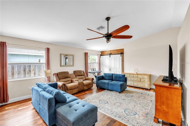 2218 Woodmere Rd, Venice, FL 34293 - living room featuring ceiling fan, wood finished floors, and vaulted ceiling