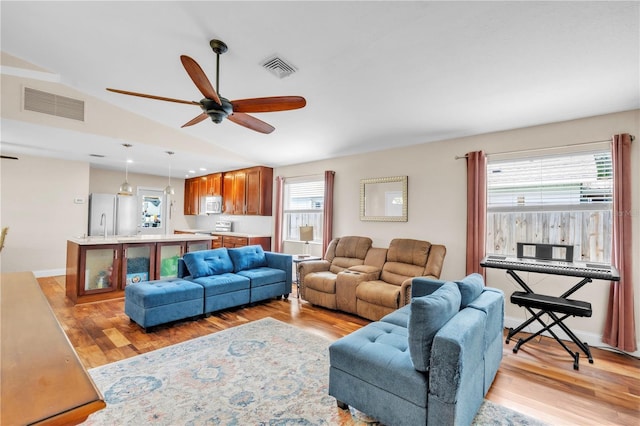 2218 Woodmere Rd, Venice, FL 34293 - living room featuring lofted ceiling, ceiling fan, light wood-style floors, and recessed lighting