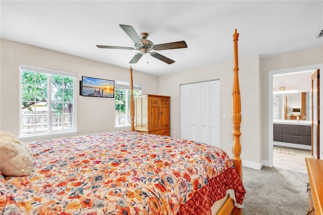 2218 Woodmere Rd, Venice, FL 34293 - bedroom with carpet floors, a ceiling fan, a closet, and ensuite bath