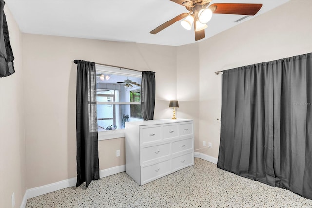 2218 Woodmere Rd, Venice, FL 34293 - bedroom with dark speckled floor and ceiling fan