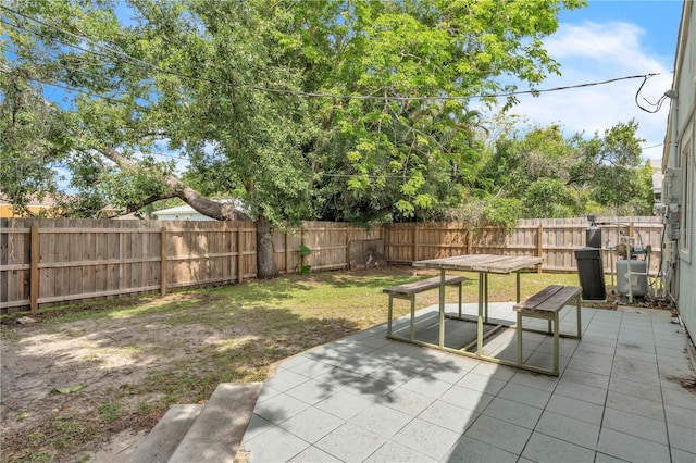 2218 Woodmere Rd, Venice, FL 34293 - fenced backyard featuring a patio area