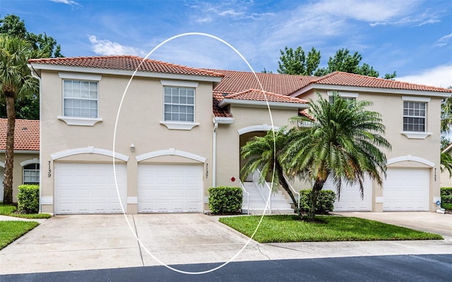7137 Cedar Hollow Cir, Bradenton, FL 34203 - view of front of property featuring a tile roof, driveway, stucco siding, and an attached garage