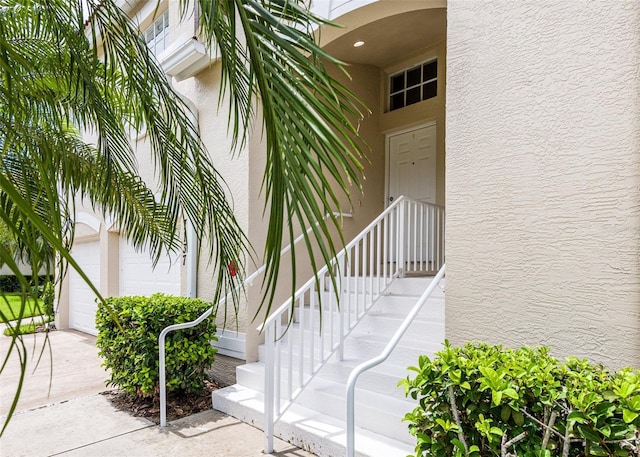 7137 Cedar Hollow Cir, Bradenton, FL 34203 - doorway to property featuring stucco siding and concrete driveway