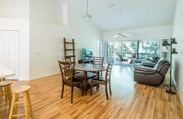 7137 Cedar Hollow Cir, Bradenton, FL 34203 - dining space featuring high vaulted ceiling, light wood finished floors, and a ceiling fan