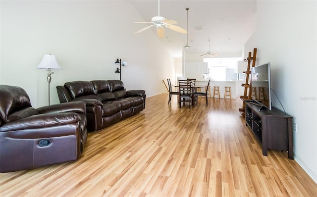 7137 Cedar Hollow Cir, Bradenton, FL 34203 - living room with ceiling fan and light wood finished floors