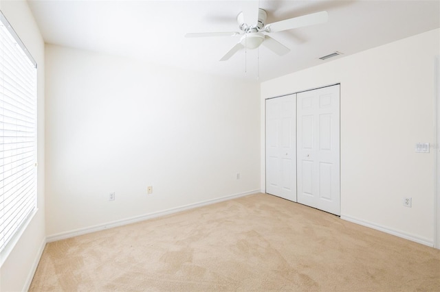 7137 Cedar Hollow Cir, Bradenton, FL 34203 - unfurnished bedroom featuring light colored carpet, a closet, and a ceiling fan