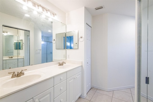 7137 Cedar Hollow Cir, Bradenton, FL 34203 - full bathroom with double vanity, tile patterned flooring, and a stall shower