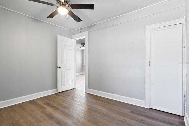 723 7th Ave N, Saint Petersburg, FL 33701 - unfurnished bedroom featuring dark wood-type flooring, a ceiling fan, and ornamental molding