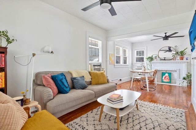 723 7th Ave N, Saint Petersburg, FL 33701 - living area with a ceiling fan, hardwood / wood-style floors, ornamental molding, a brick fireplace, and cooling unit