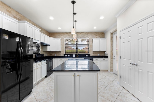 19023 Mangieri St, Venice, FL 34293 - kitchen with black appliances, white cabinetry, a kitchen island, light tile patterned floors, and hanging light fixtures