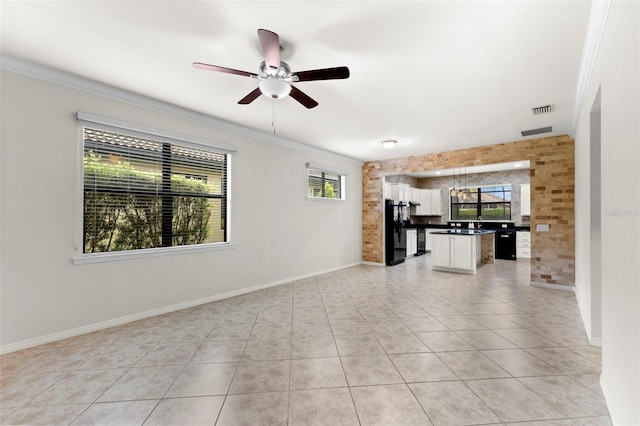 19023 Mangieri St, Venice, FL 34293 - unfurnished living room with crown molding, light tile patterned floors, and ceiling fan