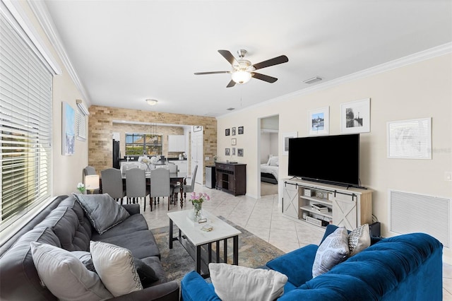 19023 Mangieri St, Venice, FL 34293 - living room with a ceiling fan, ornamental molding, and light tile patterned flooring