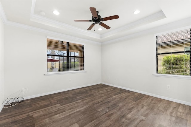19023 Mangieri St, Venice, FL 34293 - empty room with a tray ceiling, healthy amount of natural light, wood finished floors, ornamental molding, and a ceiling fan