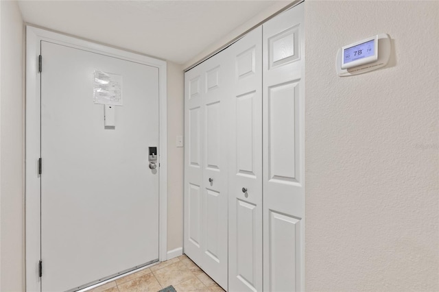 6265 Midnight Pass Rd Unit 205, Sarasota, FL 34242 - doorway to outside featuring a textured wall and light tile patterned flooring