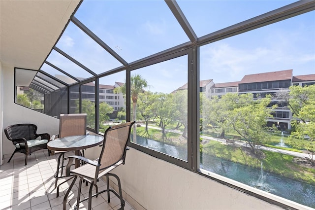 6265 Midnight Pass Rd Unit 205, Sarasota, FL 34242 - sunroom / solarium featuring plenty of natural light and a water view