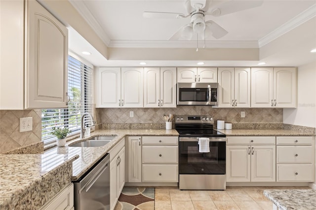6265 Midnight Pass Rd Unit 205, Sarasota, FL 34242 - kitchen with stainless steel appliances, ornamental molding, light stone counters, a ceiling fan, and tasteful backsplash