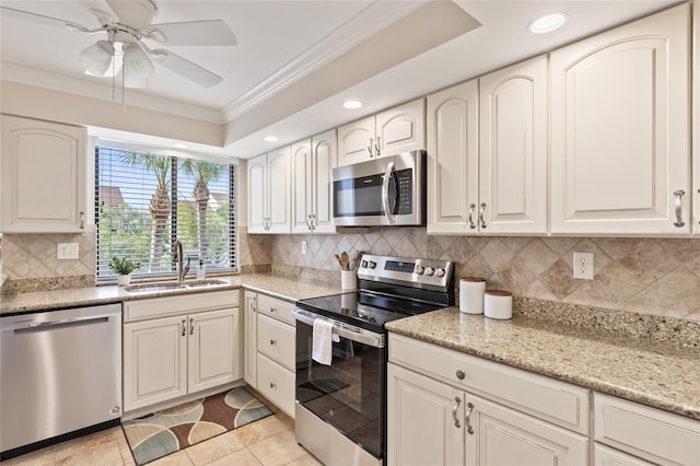 6265 Midnight Pass Rd Unit 205, Sarasota, FL 34242 - kitchen with stainless steel appliances, crown molding, recessed lighting, ceiling fan, and backsplash