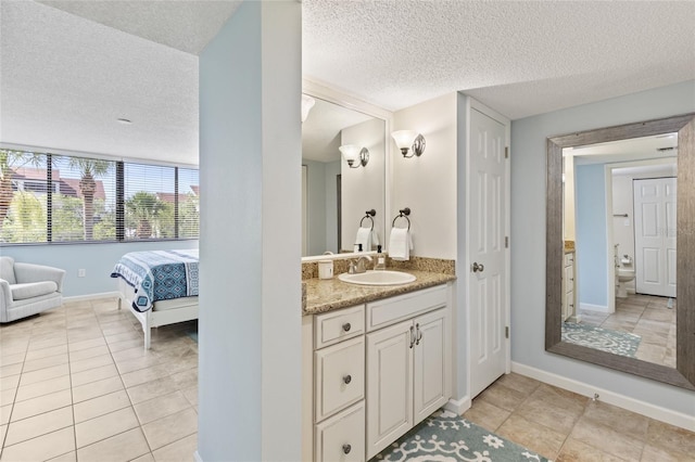 6265 Midnight Pass Rd Unit 205, Sarasota, FL 34242 - full bathroom with a textured ceiling, vanity, and tile patterned flooring