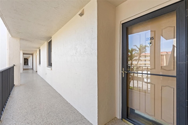 6265 Midnight Pass Rd Unit 205, Sarasota, FL 34242 - doorway to property with stucco siding and a balcony