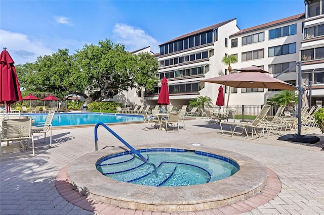 6265 Midnight Pass Rd Unit 205, Sarasota, FL 34242 - community pool with a community hot tub and a patio area
