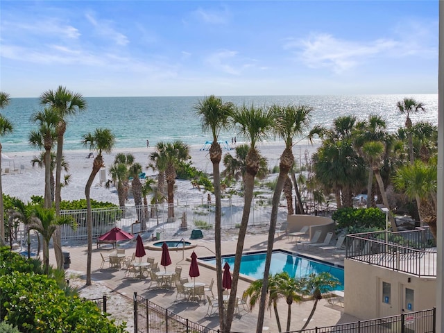 6265 Midnight Pass Rd Unit 205, Sarasota, FL 34242 - community pool featuring a patio area and view of water and beach