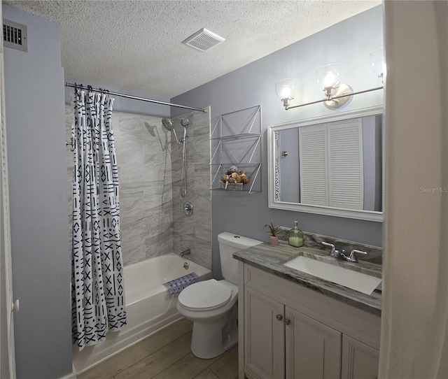 4001 Beneva Rd Unit 319, Sarasota, FL 34233 - full bathroom featuring shower / bath combination with curtain, vanity, a textured ceiling, and wood finished floors