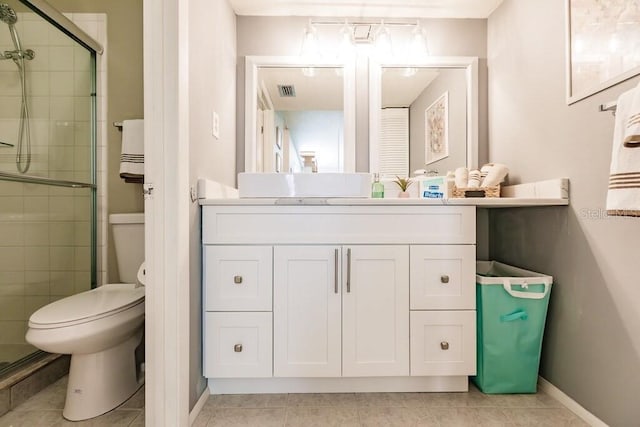 4001 Beneva Rd Unit 319, Sarasota, FL 34233 - bathroom with a stall shower, vanity, and tile patterned flooring