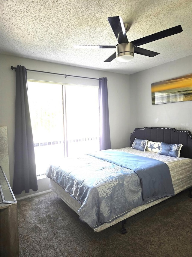 4001 Beneva Rd Unit 319, Sarasota, FL 34233 - bedroom with carpet floors, ceiling fan, and a textured ceiling