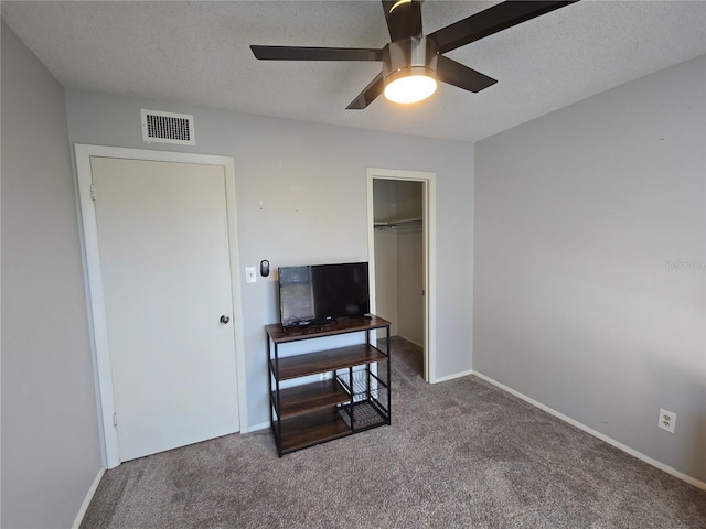 4001 Beneva Rd Unit 319, Sarasota, FL 34233 - bedroom with carpet, a ceiling fan, a closet, and a textured ceiling