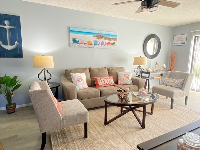 4001 Beneva Rd Unit 319, Sarasota, FL 34233 - living room featuring a textured ceiling, ceiling fan, and wood finished floors