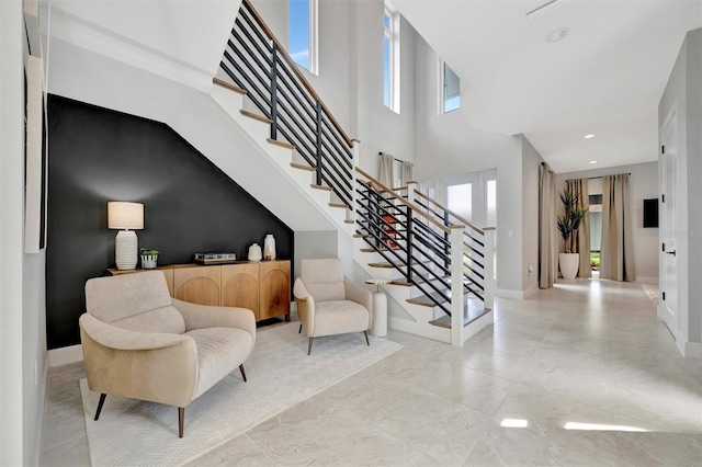 6317 Turtle Grass Dr, Bradenton, FL 34210 - stairway featuring recessed lighting and a towering ceiling