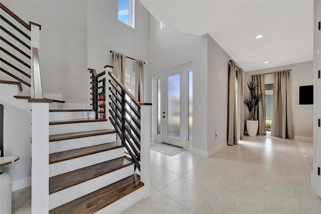 6317 Turtle Grass Dr, Bradenton, FL 34210 - tiled foyer entrance featuring stairs, a towering ceiling, and recessed lighting
