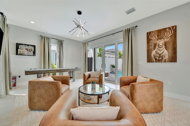 6317 Turtle Grass Dr, Bradenton, FL 34210 - living room featuring a chandelier, recessed lighting, and light tile patterned flooring
