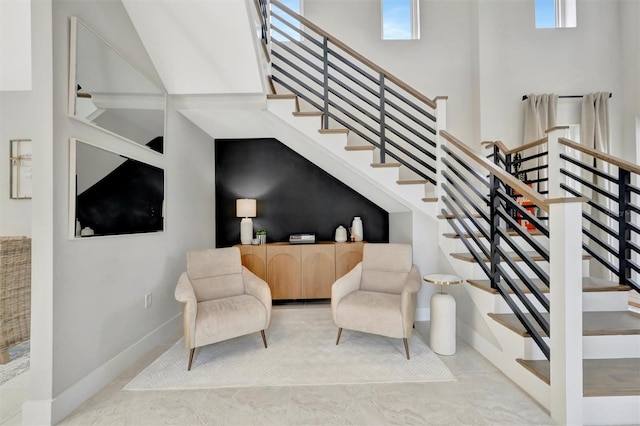 6317 Turtle Grass Dr, Bradenton, FL 34210 - staircase with baseboards and a high ceiling