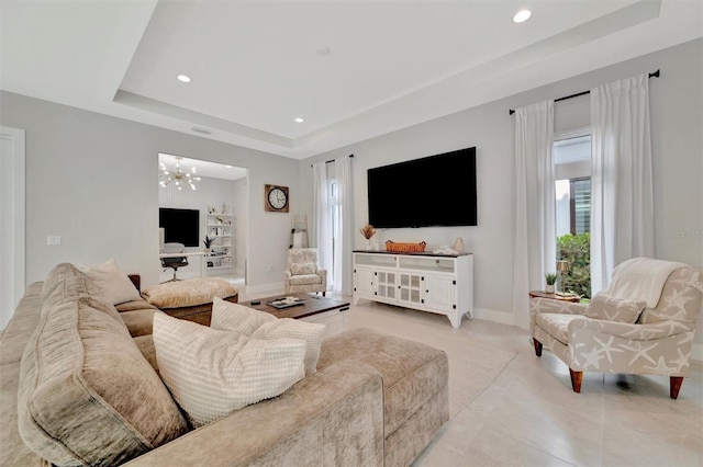6317 Turtle Grass Dr, Bradenton, FL 34210 - living room with a raised ceiling, recessed lighting, a chandelier, and light tile patterned floors