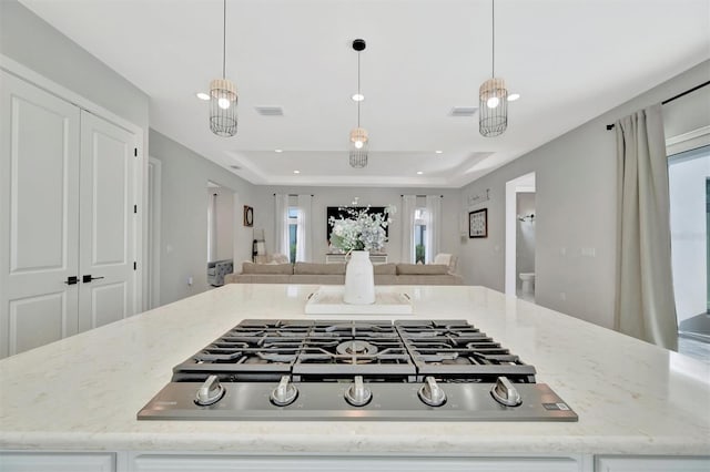 6317 Turtle Grass Dr, Bradenton, FL 34210 - kitchen featuring stainless steel gas cooktop, open floor plan, plenty of natural light, light stone counters, and recessed lighting