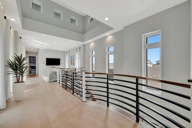 6317 Turtle Grass Dr, Bradenton, FL 34210 - hall featuring an upstairs landing, a towering ceiling, recessed lighting, and light wood finished floors