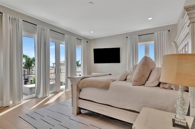 6317 Turtle Grass Dr, Bradenton, FL 34210 - bedroom with multiple windows, recessed lighting, and access to exterior