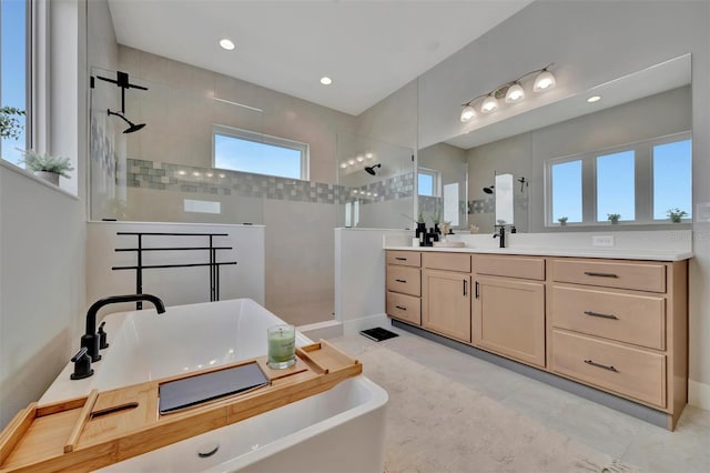 6317 Turtle Grass Dr, Bradenton, FL 34210 - full bath with a walk in shower, vanity, a freestanding tub, and recessed lighting