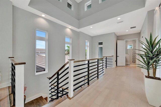 6317 Turtle Grass Dr, Bradenton, FL 34210 - hallway featuring an upstairs landing, recessed lighting, and wood finished floors